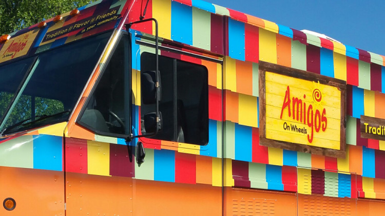 Amigo's service vehicle with custom decal graphics