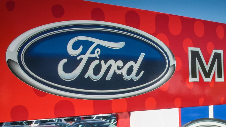 Ford dealership exterior with large-format printed and installed building graphics