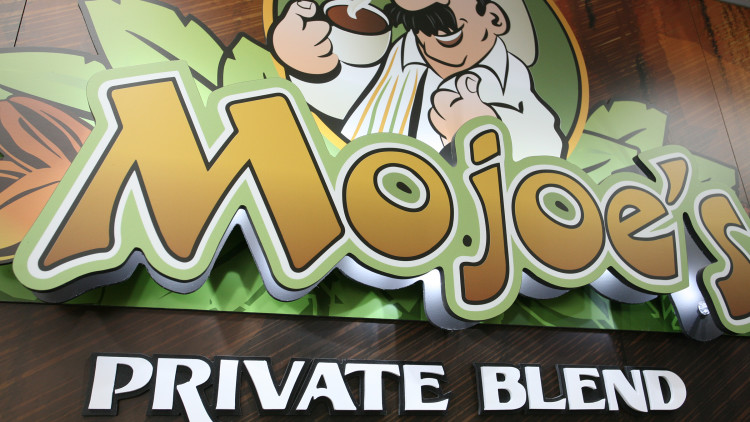 Moto Mart interior decor with backlit signage and branded wall graphics